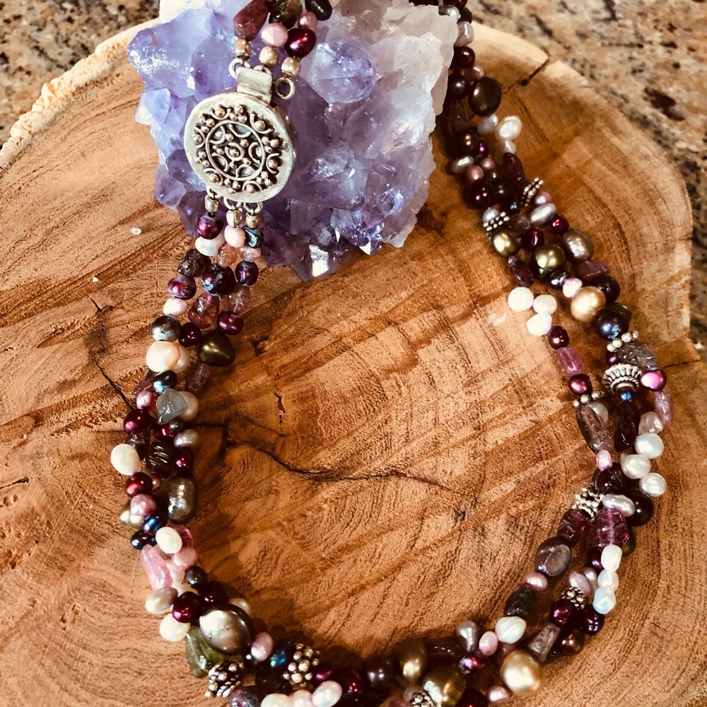 Triple strand of multi colored pearls, raw tourmaline and sterling silver beads.